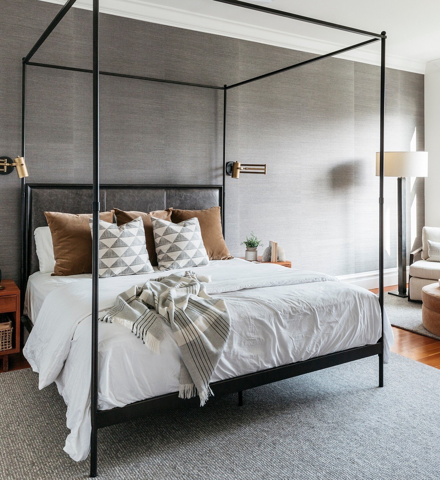 Throwback to 2019 with the primary bedroom at our #ProjectNoeValleyRedeux ⁠
Our clients wanted luxe hotel vibes and a space that felt like a reprieve from their busy lives. This tonal space with moody grasscloth wallpaper and metal and leather four p