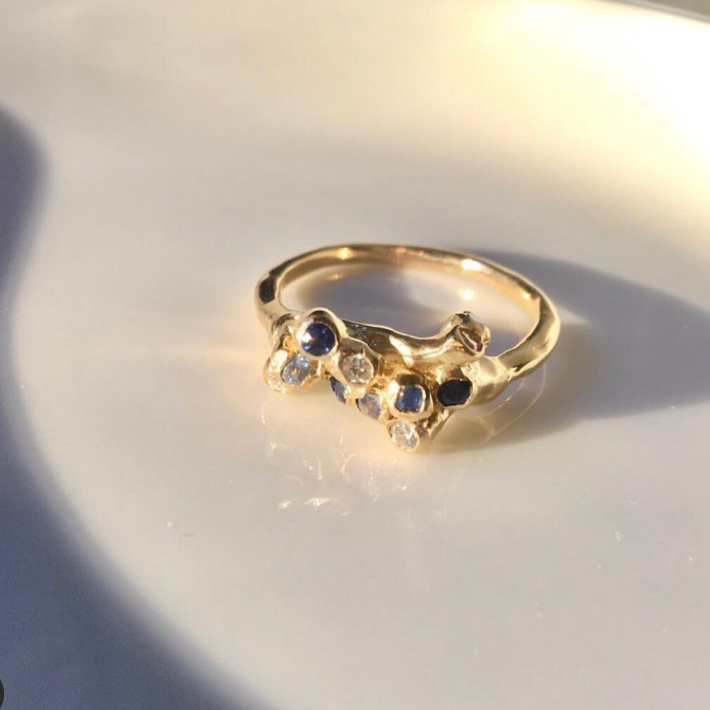 Wedding ring in the morning light @hpfchristopher 
Sea Anemone cluster of diamonds mixed with pale and dark blue sapphire