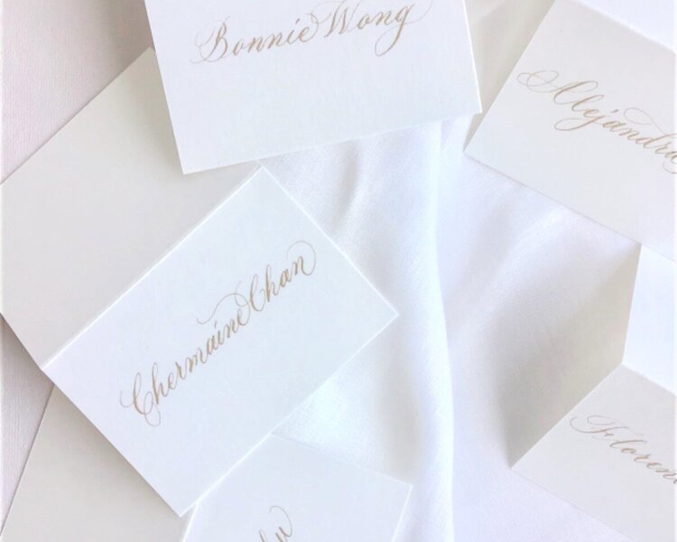 Hong Kong hk calligrapher writing event place cards for luxury brand Hermes VIP event, white card with gold ink