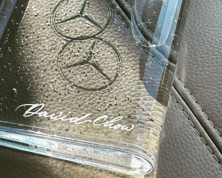 Hong Kong hk calligrapher personalizing on Mercedes-Benz water bottle souvenir with calligraphy in silver pen