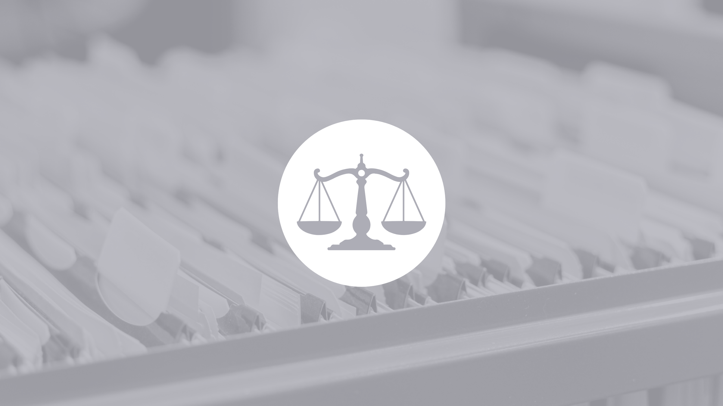 A grayscale image of a scale icon in the center with a blurred background of piano keys.