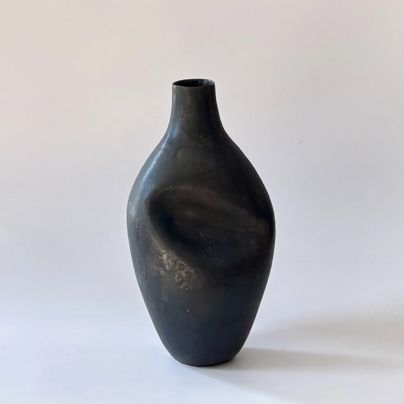 black dent vase