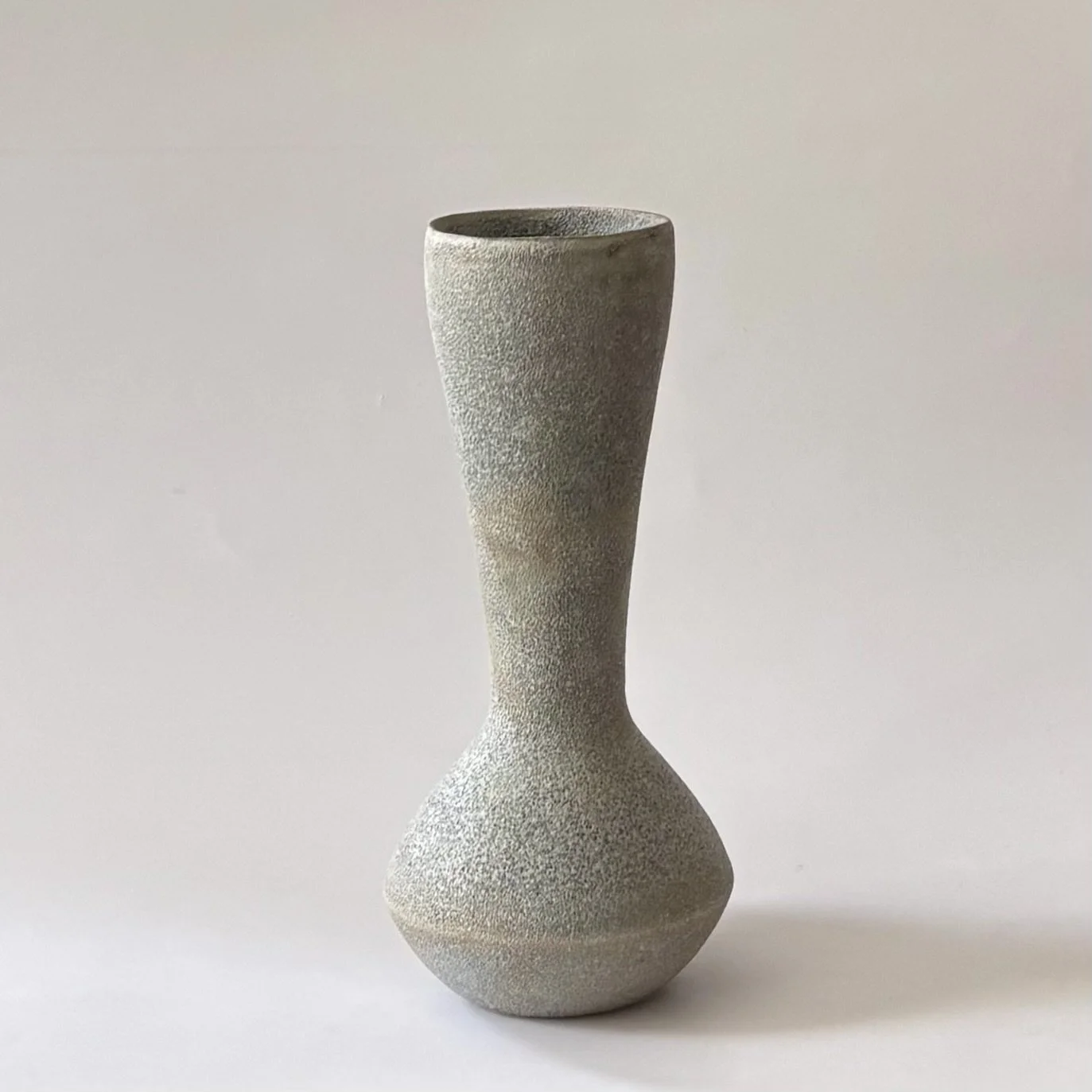 textured stone hourglass vase