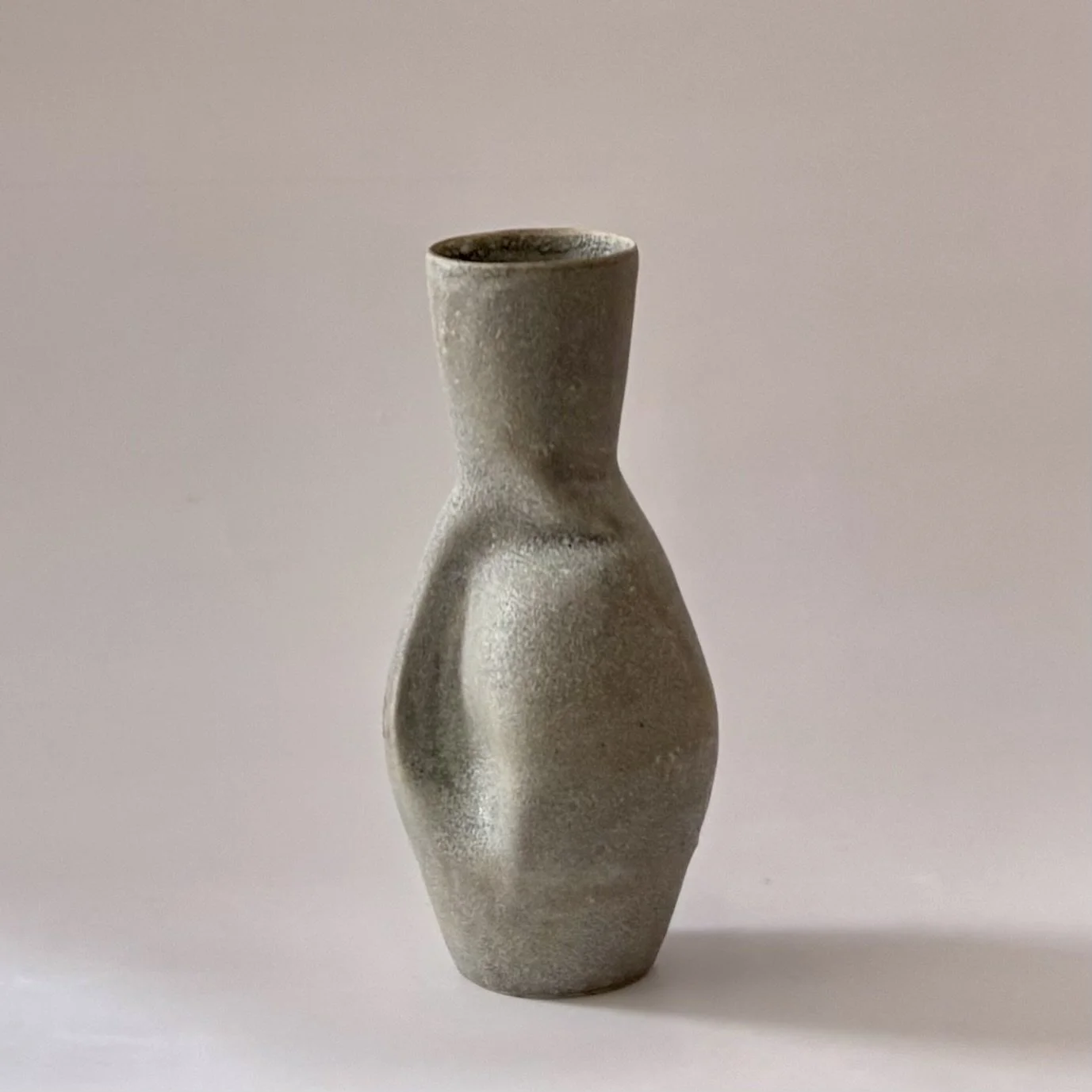 textured stone warp vase