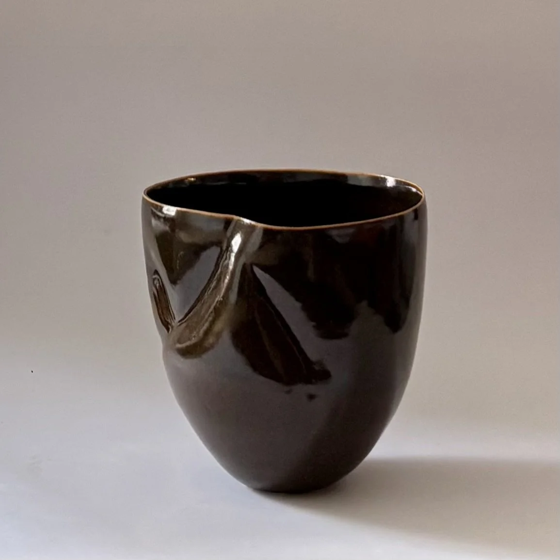 glossy amber vessel