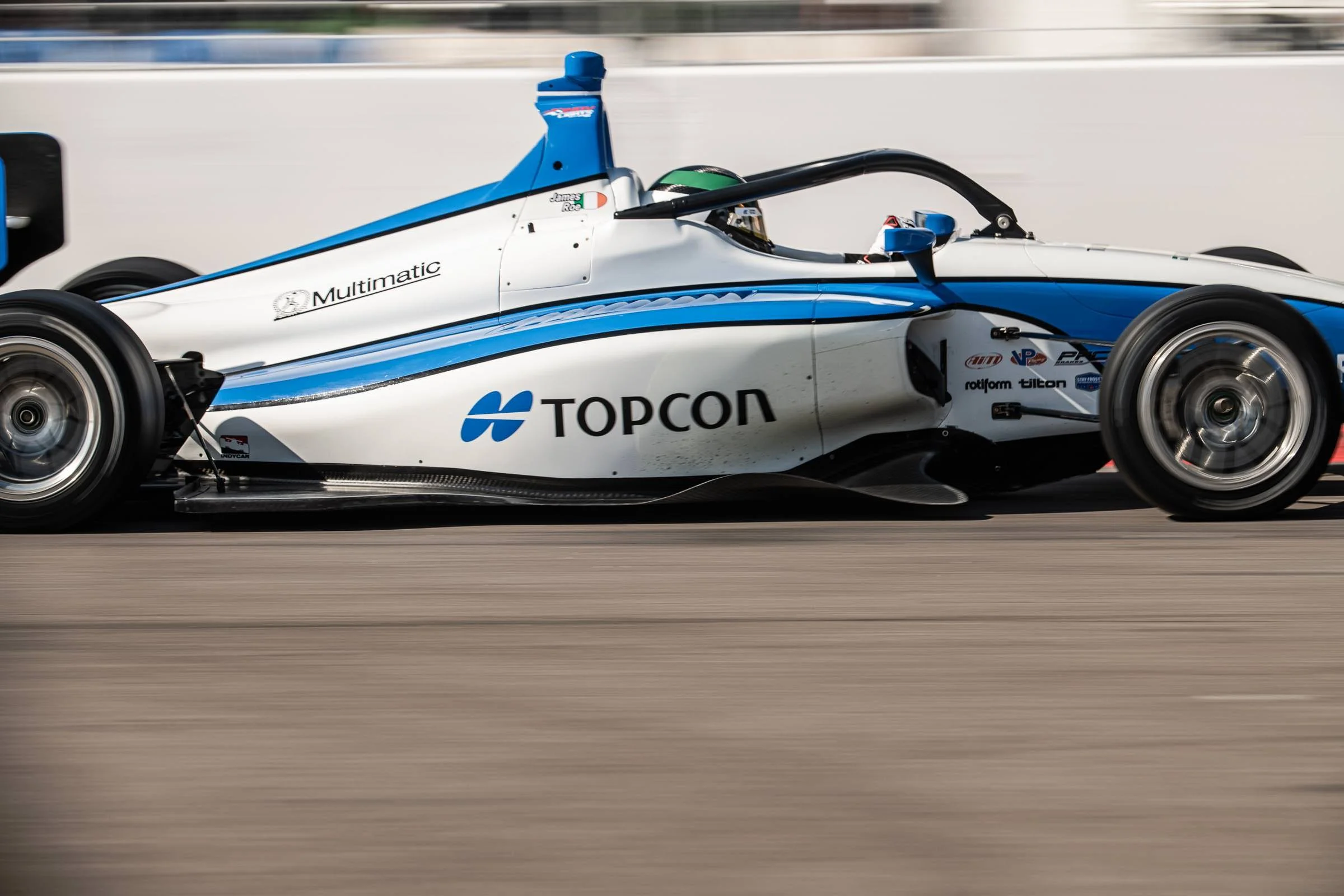 Side shot of Topcon's Indy lights car