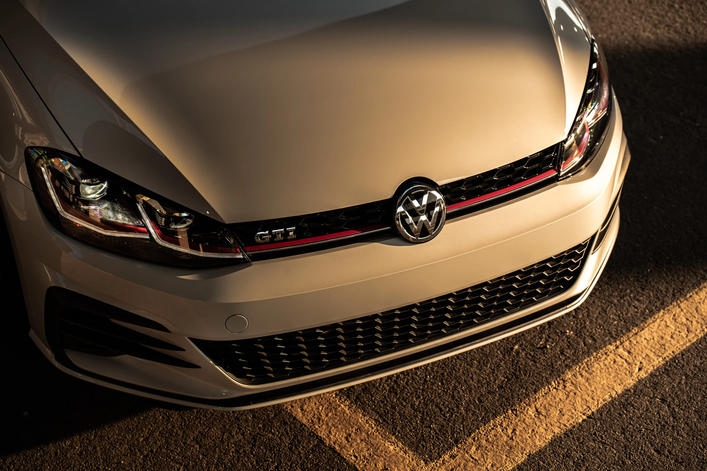 Automotive Photography Volkswagen VW Golf GTI at sunset in a parking lot by David Loi