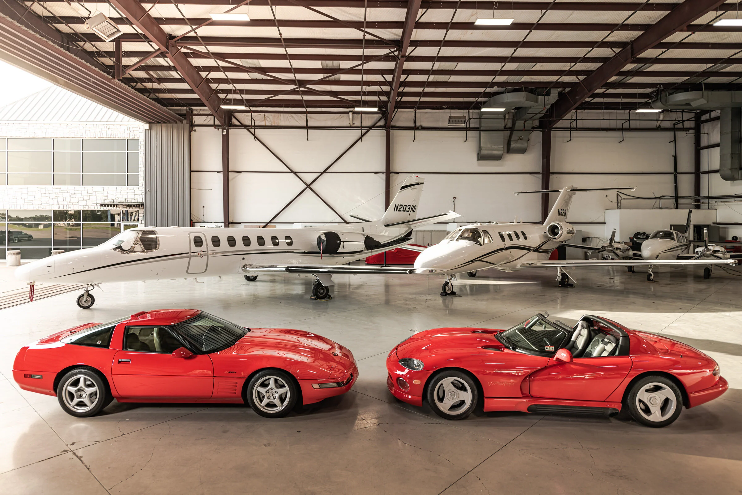 Automotive Photography Dodge Viper and Corvette ZR-1 faceoff in front of airplanes by David Loi