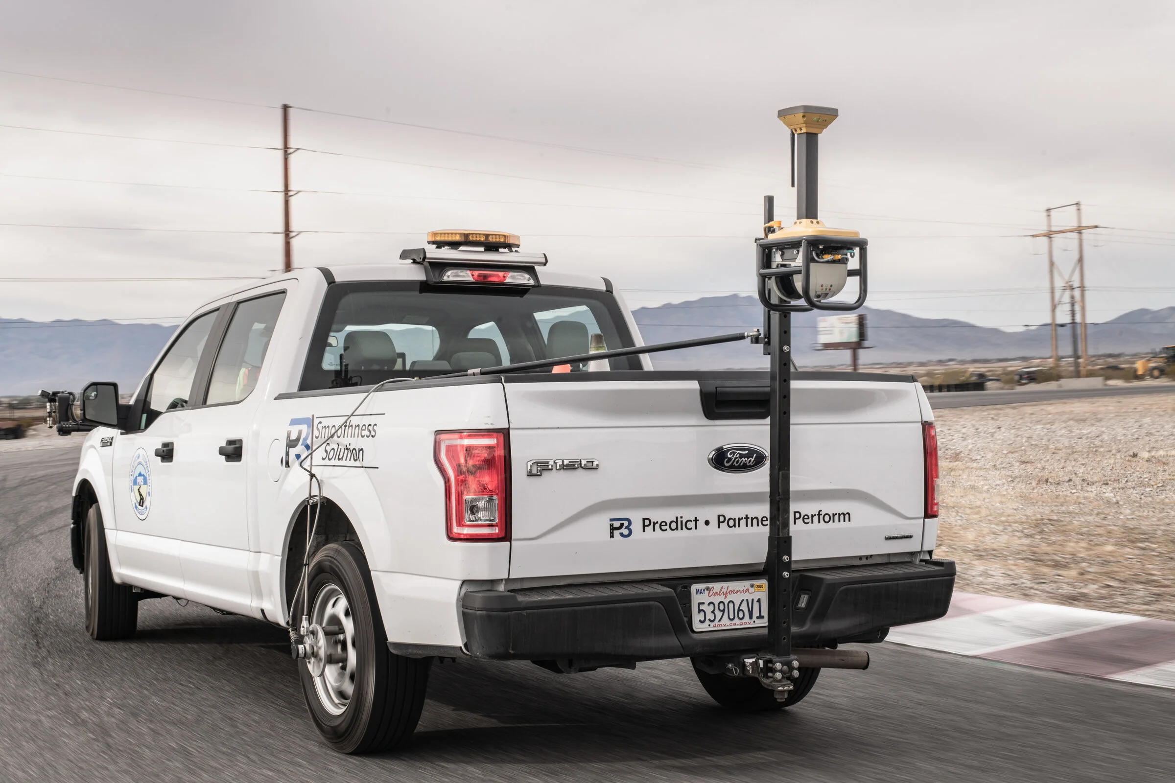 Commercial Photography for Topcon Laser Scanner being setup on the back of a truck at the Spring Mountain Motorsports Ranch in Las Vegas, NV by David Loi