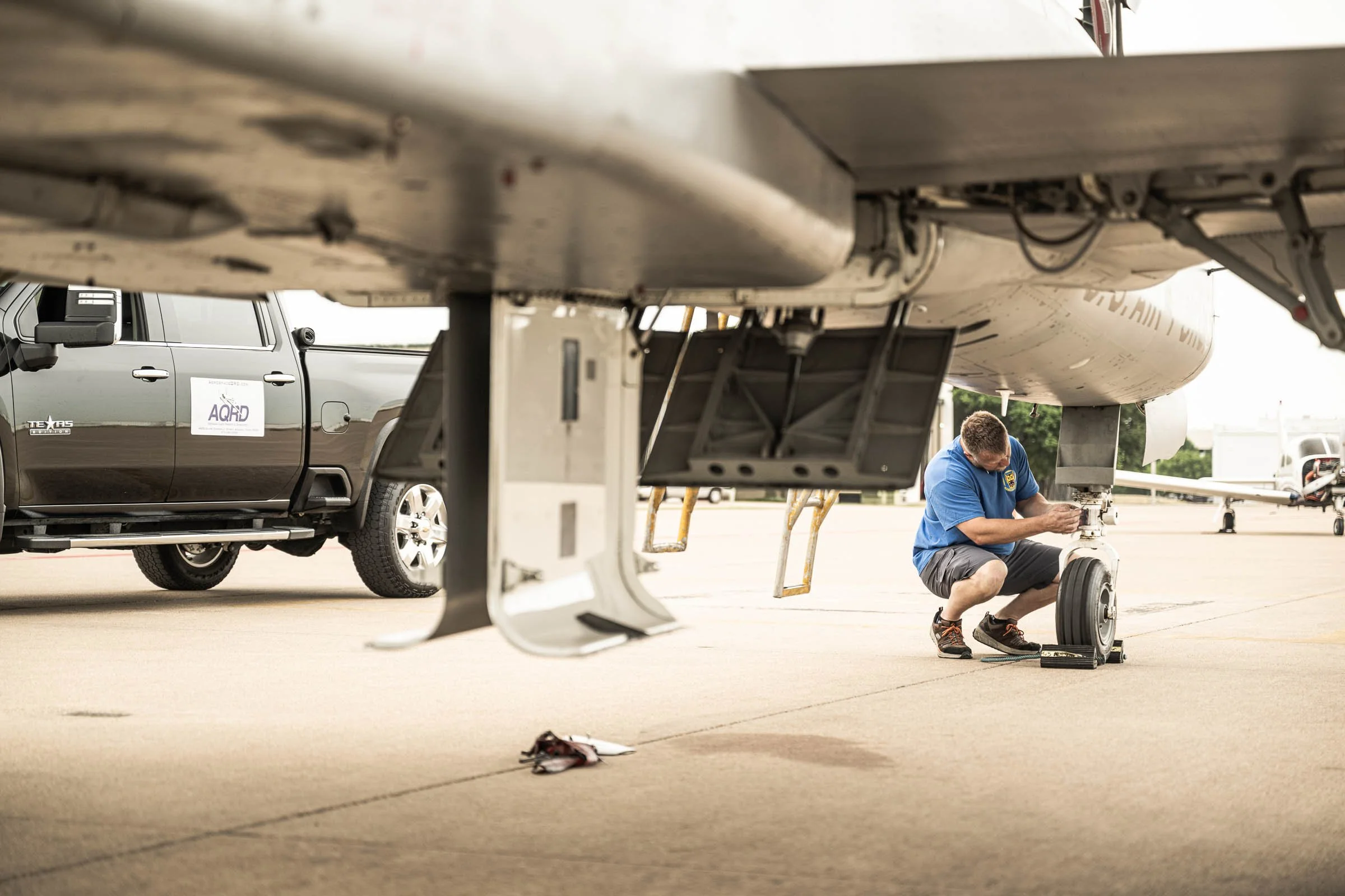 F5B Freedom Fighter sits on the ramp and being tended to by an  AQRD technican at Alliance Airport (AFW) in Ft Worth, TX