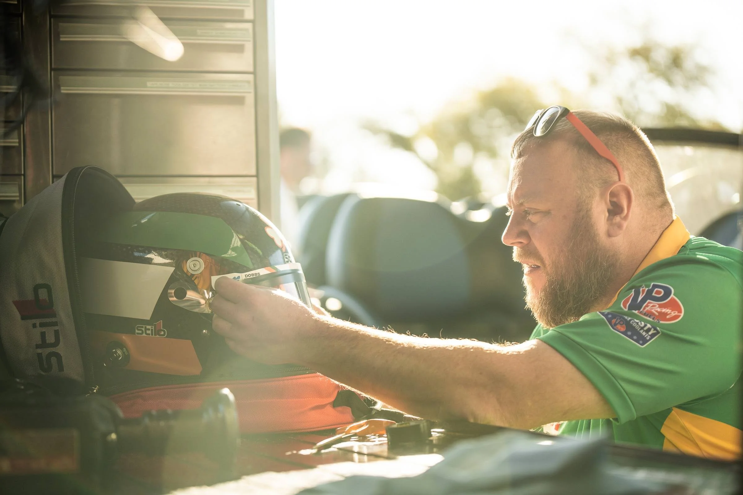 Mechanics get James Roe's helmet ready 
