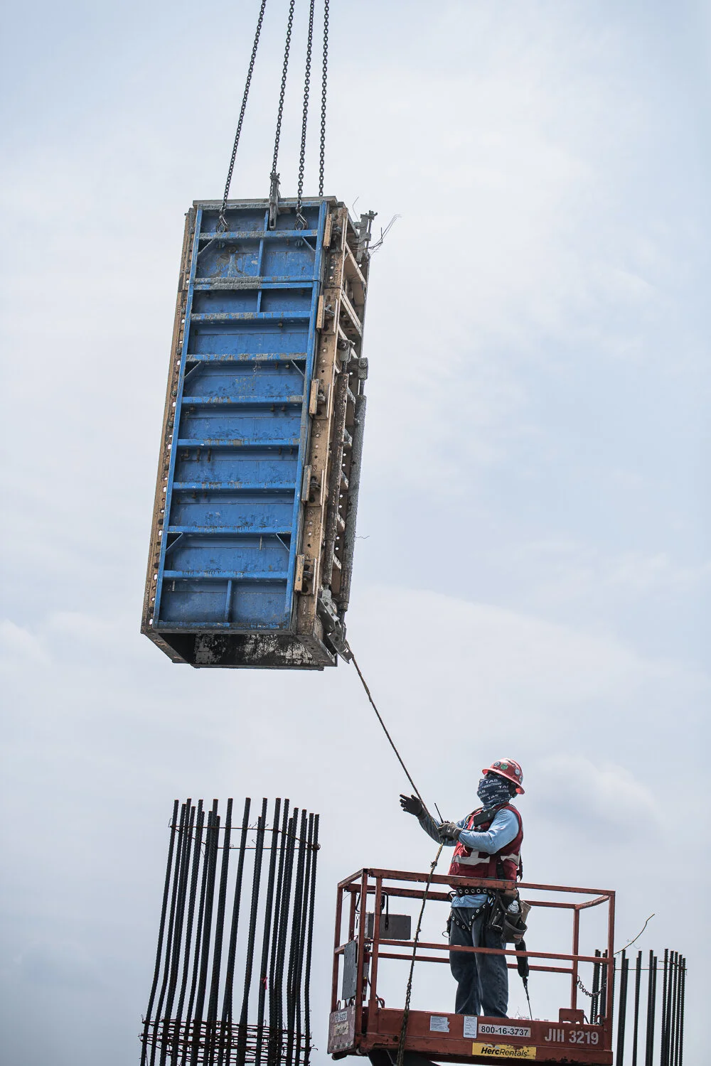 Commercial photography with TAS Concrete crane on a high-rise by David Loi