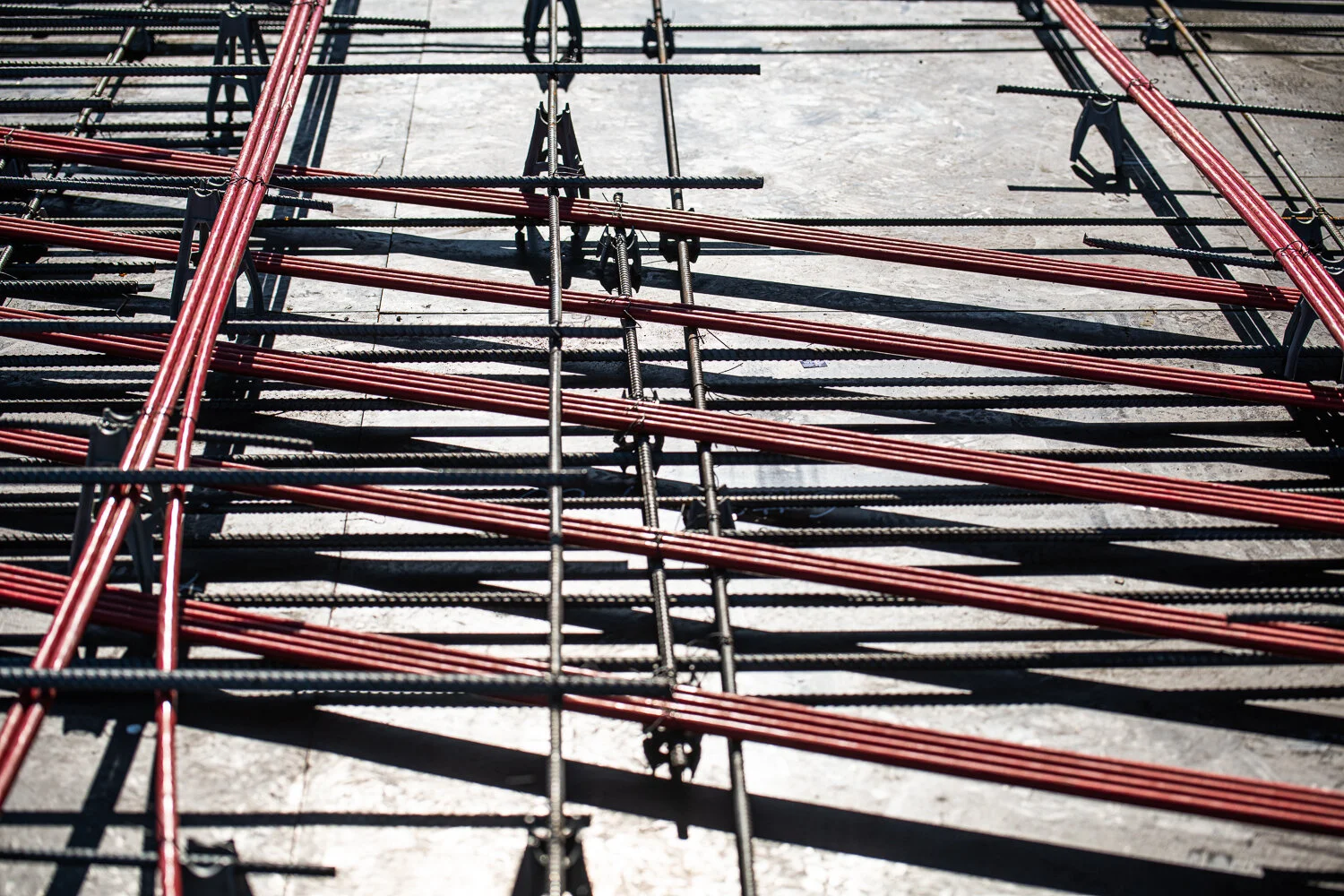 Cables and Rebar running across a construction site in Houston, TX by David Loi