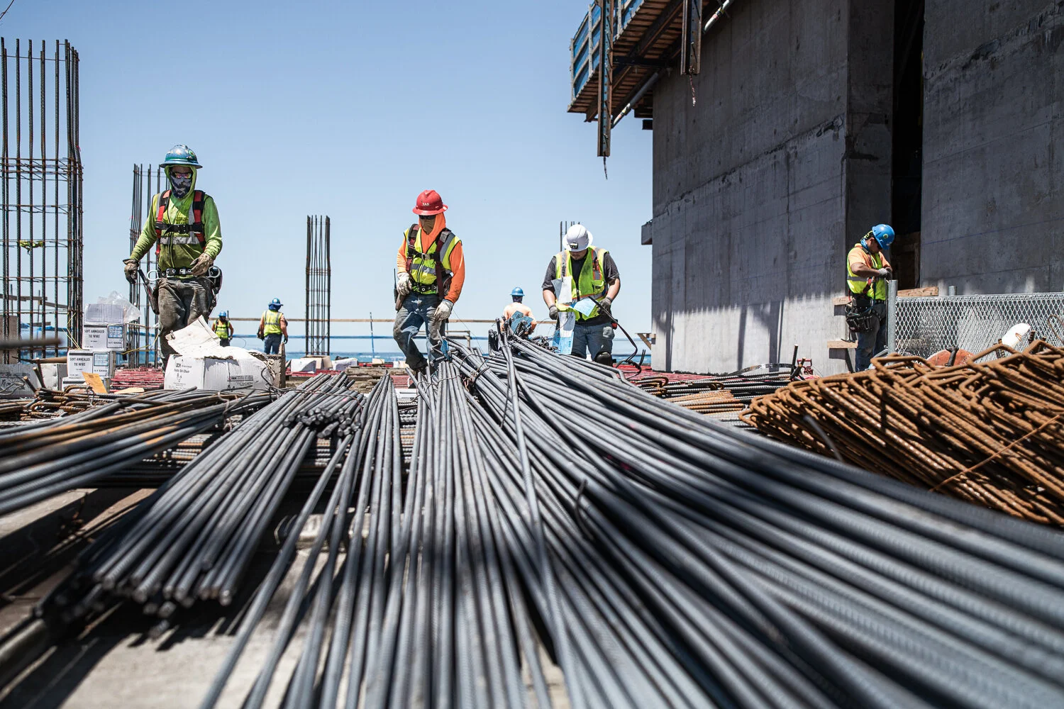 Commercial photography with TAS Concrete construction workers picking up rebar by David Loi