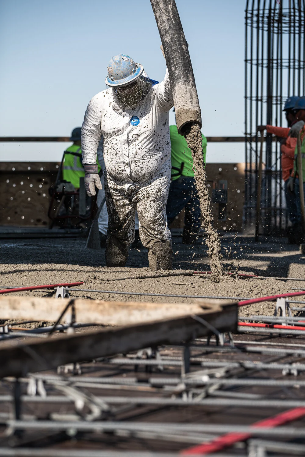 Commercial photography showing Construction site with workers on high-rise by David Loi