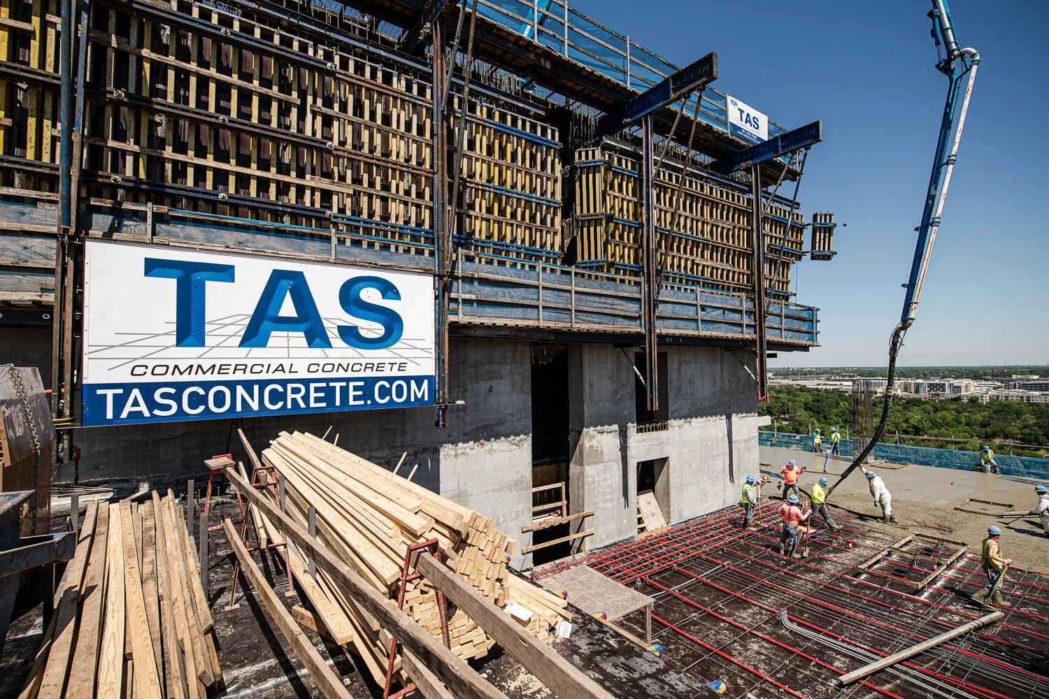 Commercial photography showing Construction site with workers on high-rise by David Loi
