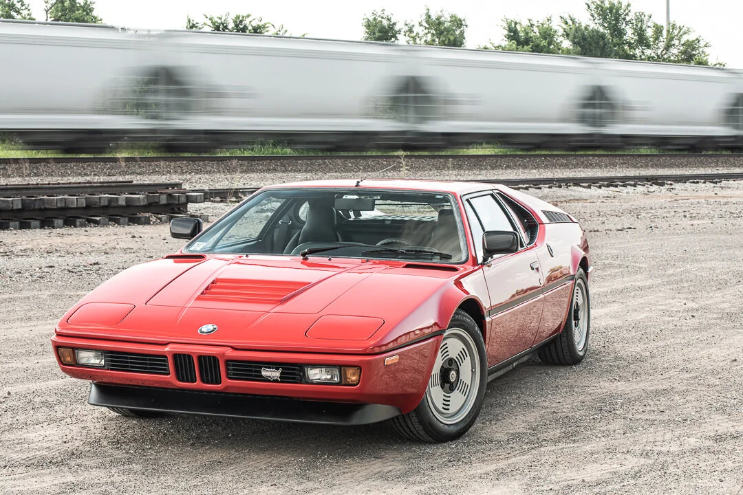 Automotive Photography BMW M1 in front of moving train by David Loi