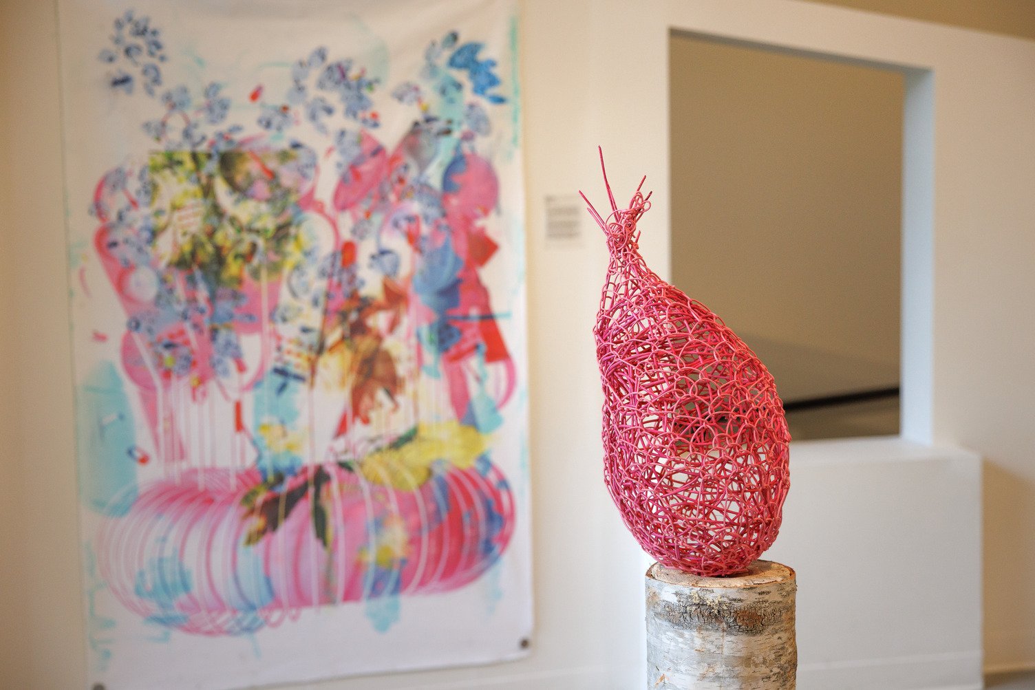 Colorful local artwork displayed inside a Portsmouth, New Hampshire gallery near Hotel Thaxter.