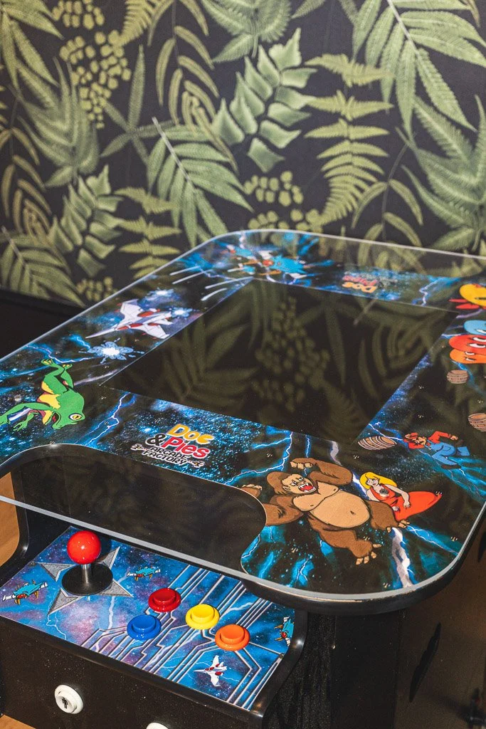 Arcade game in the TV room of the Downtown Luxury Condo at Hotel Thaxter in Portsmouth, New Hampshire.