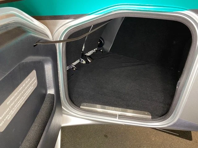 open trunk of a car with a black interior