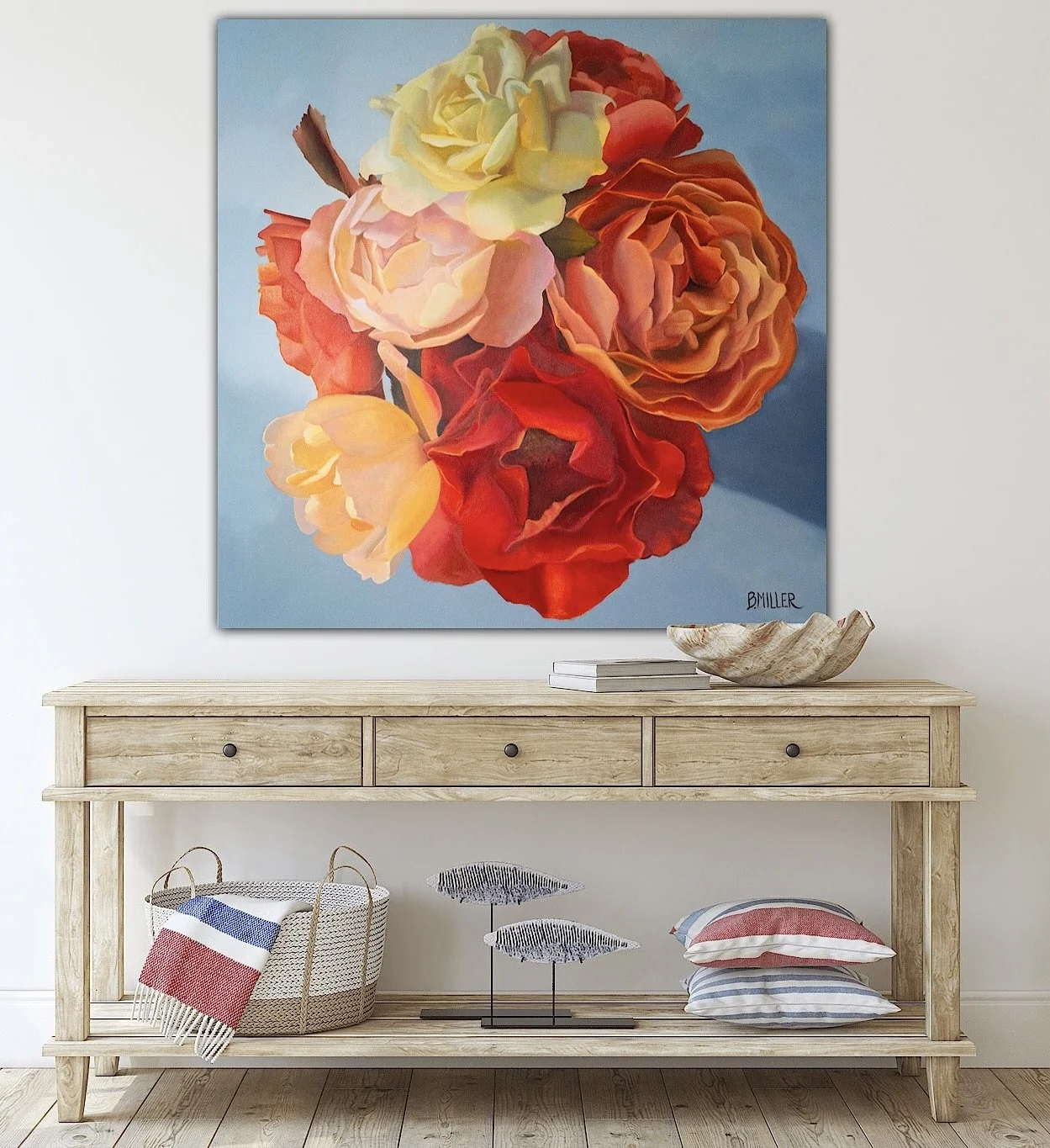 Large flower painting on wall above wooden console table with decorative items.