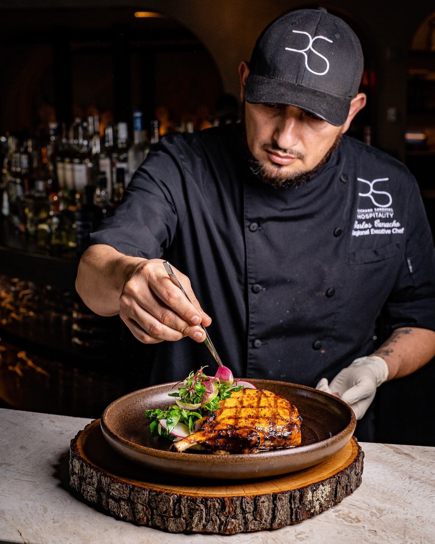 Chef Camacho is always taking our menu to new levels. Here he is putting the finishing touches on a dLe&ntilde;a favorite, our Carnitas Pork Shank.
.
.
.
.
.
#DlenaDC #RSHospitality #ChefRichardSandoval #WashingtonDC #MtVernonTriangle #DistrictofColu