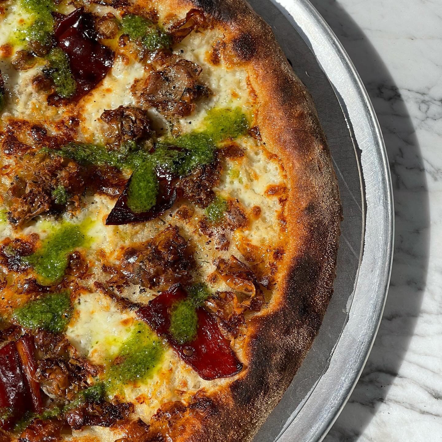 PORCHETTA goat horn peppers / fresh mozzarella/ piave vecchio 

NOTE: The need for smell-o-vision is strong. Walking this pizza to the patio, three people commented on how good it smelled. The crispy bits, the dried peppers. OMG #forthetable The pizz