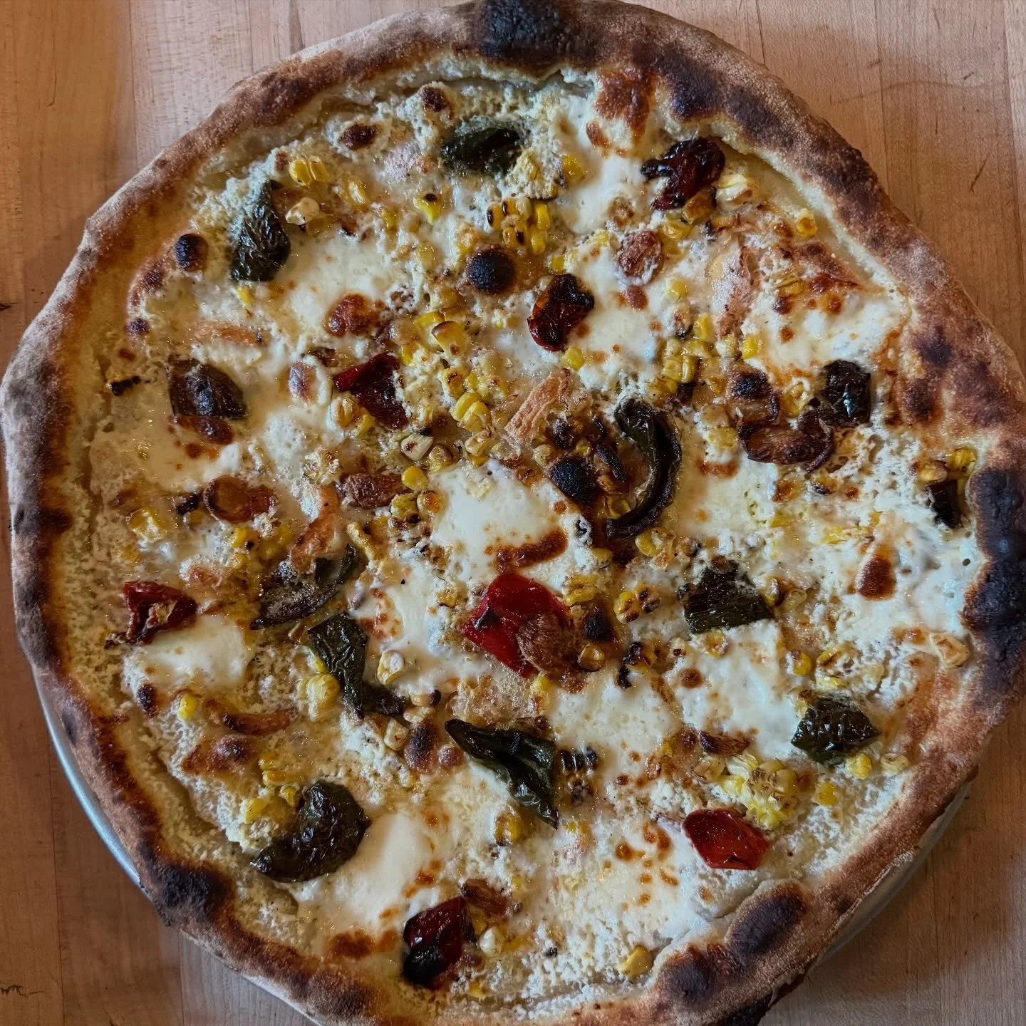 Our pizza is GOLD right now. Stay off Reddit and come try it yourself. Might be that new flour combo? Might be the szn? 

ROASTED PEPPERS
sweet corn / taleggio / confit garlic 

#techbros #yourmom #seattle #stoneburnerseattle #pizzanight