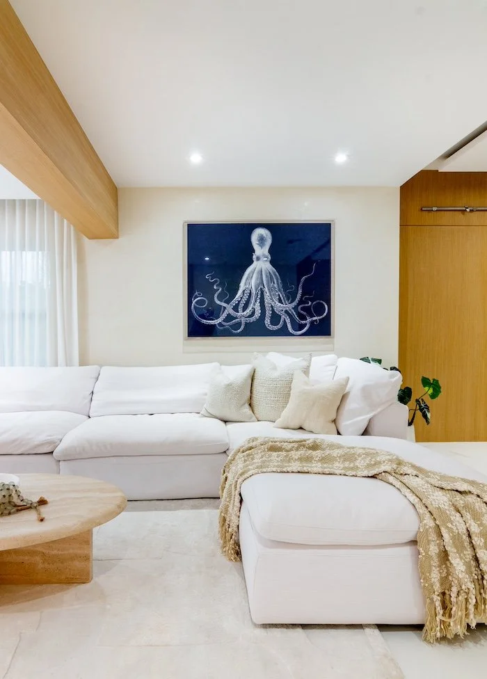wooden-beams-octopus-artwork-white-couch-livingroom.jpg