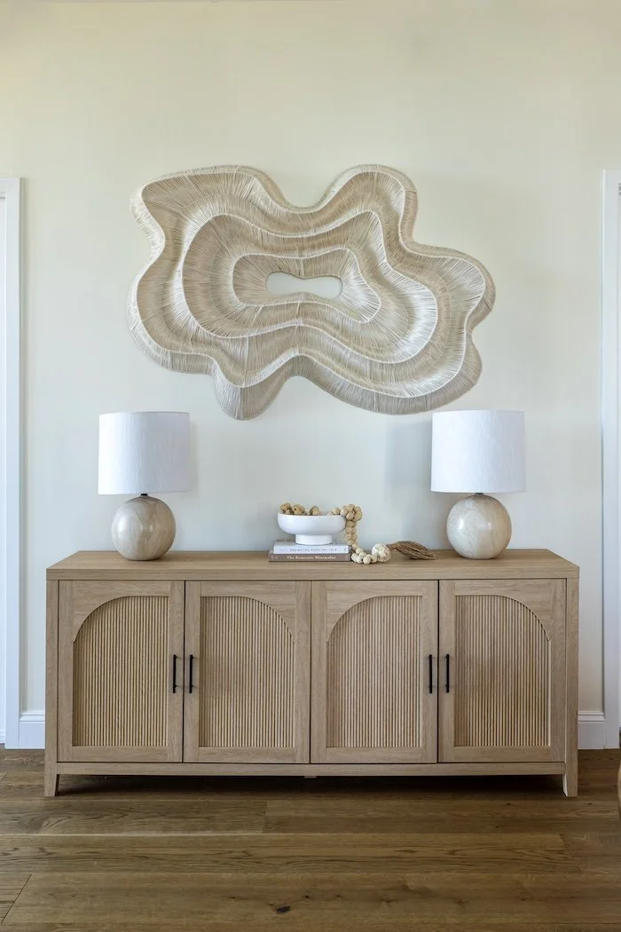 natural-wood-buffet-two-white-lamps-organic-artwork.jpg