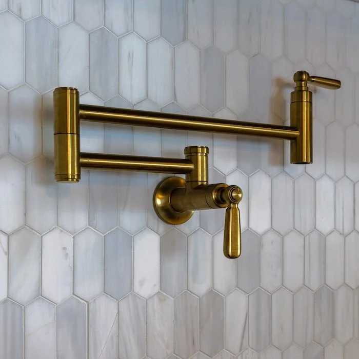 pot-filler-above-stove-bronze-marble-backsplash.jpg