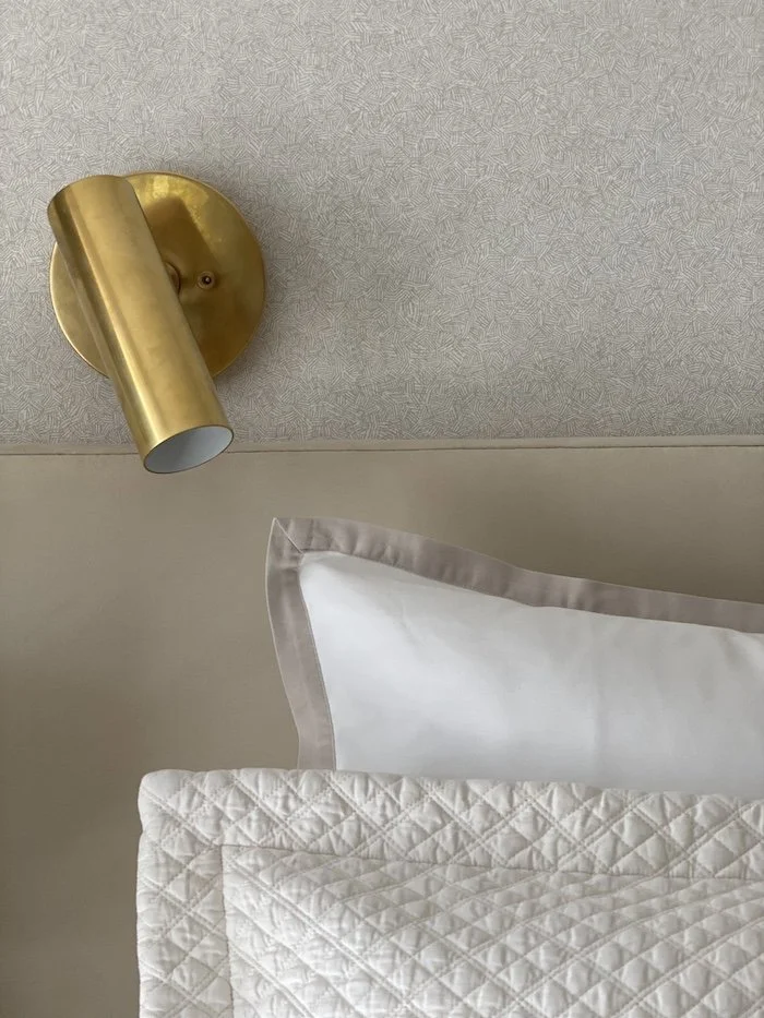 gold-sconce-above-bed.jpg