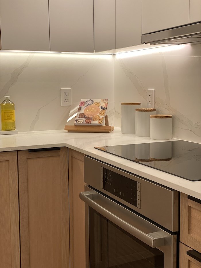 underneath-cabinet-lighting-modern-two-toned-kitchen.jpg