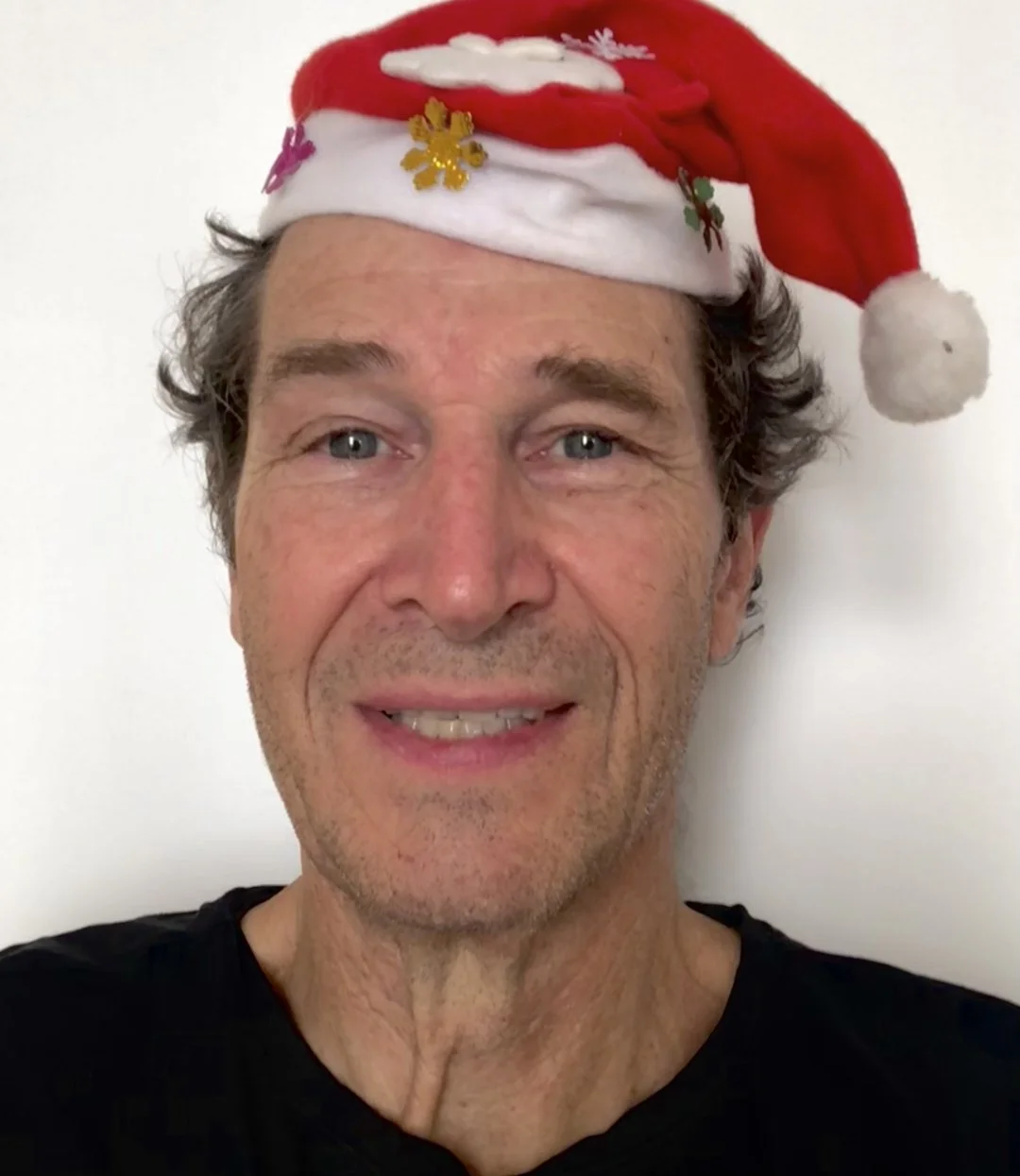 Casper full face portrait with a Christmas hat on.