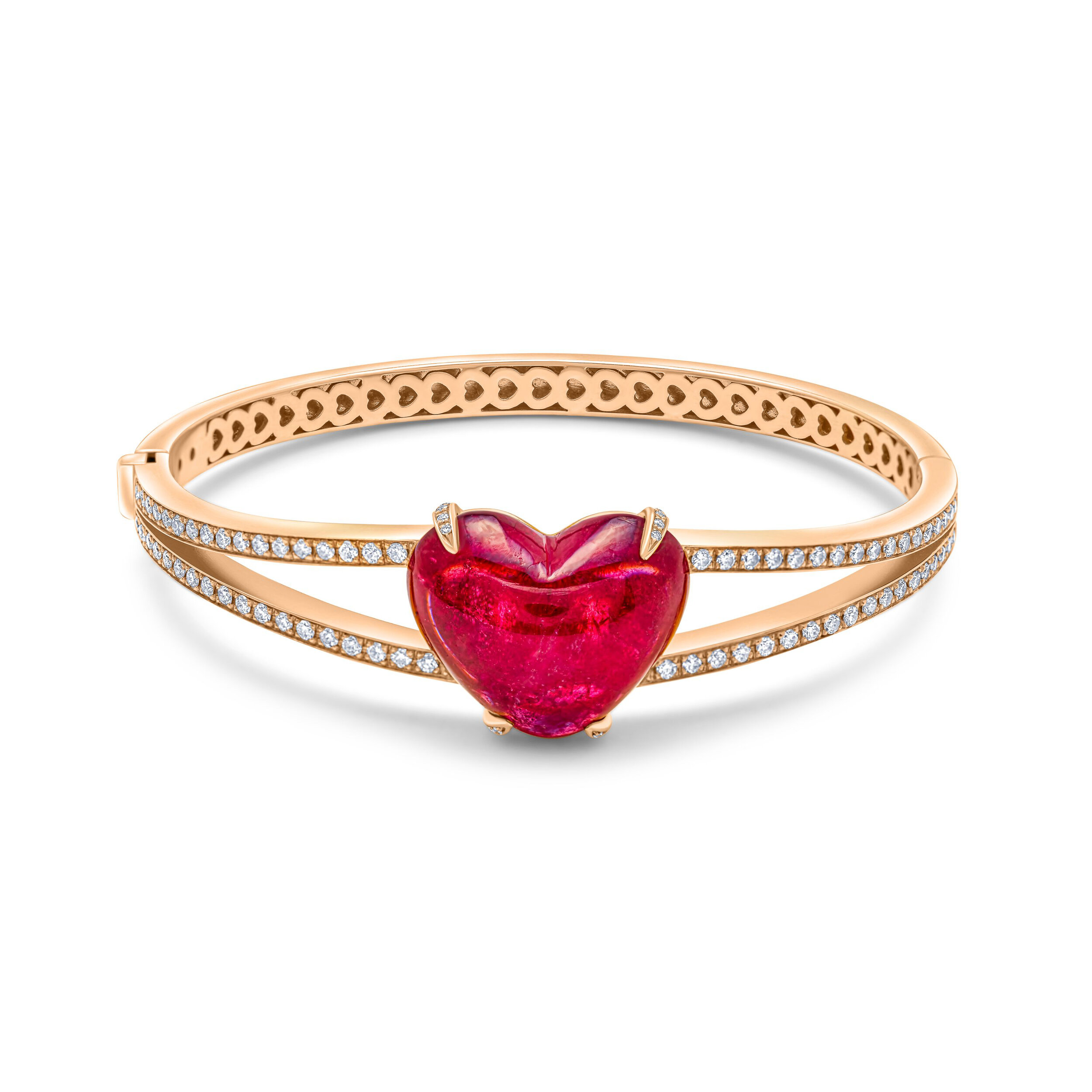 Gold bracelet with a red heart-shaped gemstone in the center and small embedded diamonds along the band.