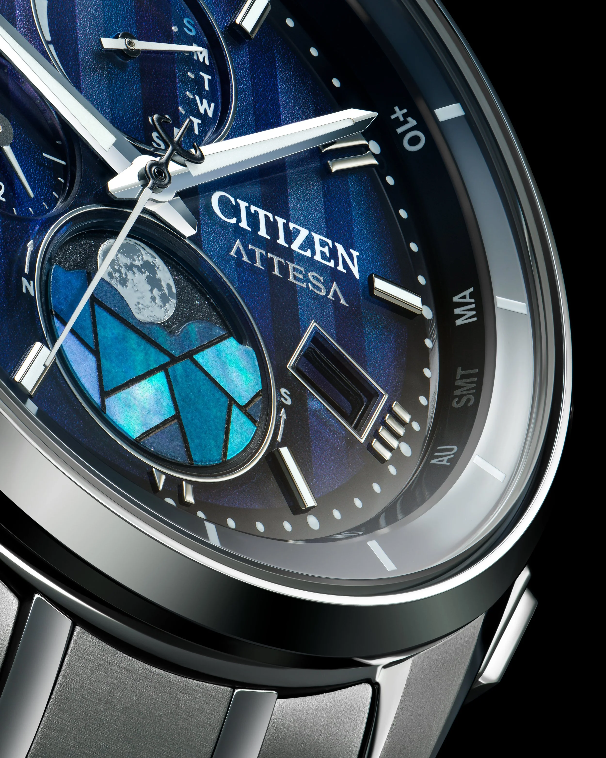 Close-up of a Citizen Attesa wristwatch with a blue dial, moon phase display, multiple sub-dials, and a metal band.