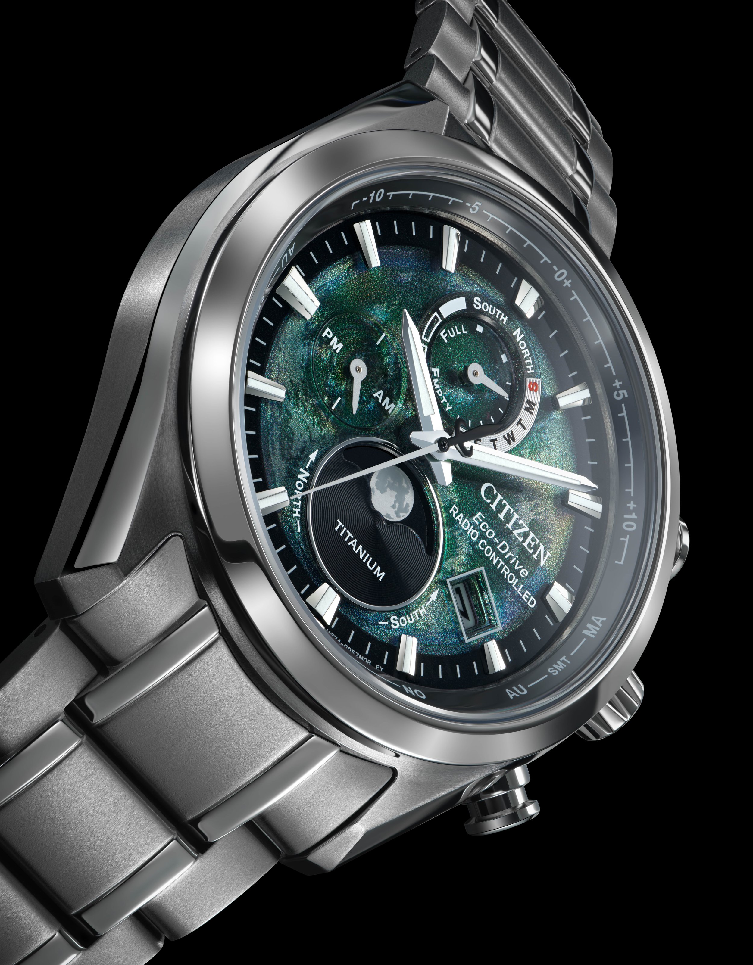 A Citizen Eco-Drive titanium watch with multiple dials, a green Earth design on the face, and a metal band.