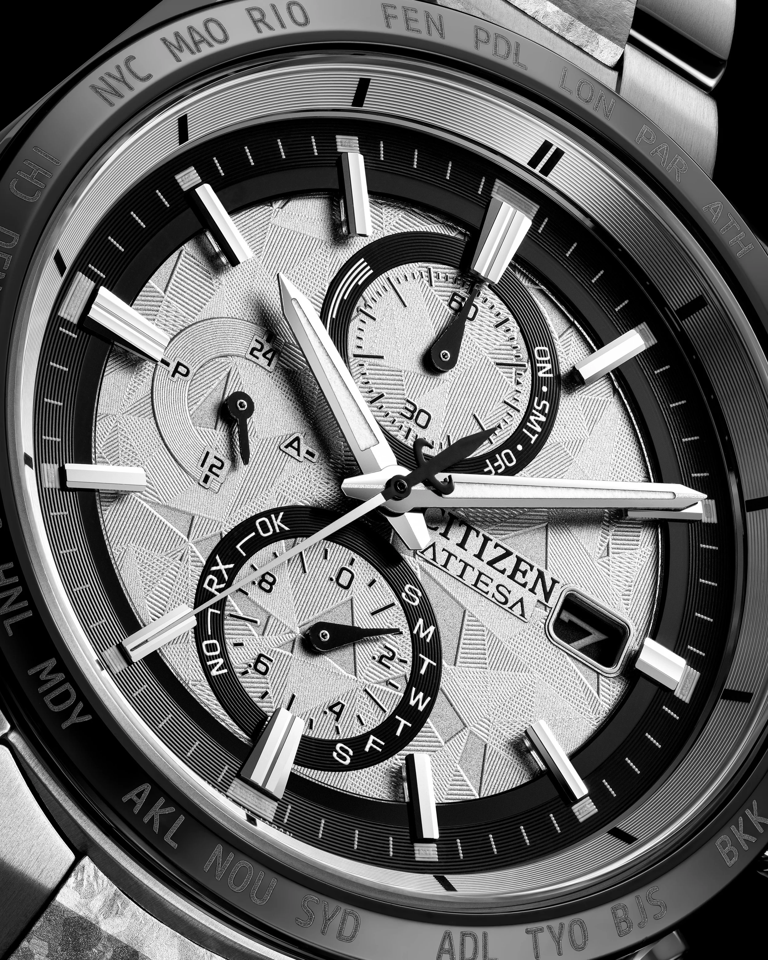 Close-up of a Citizen Chronograph wristwatch with multiple subdials, a textured silver face, and a date window showing the number 7.