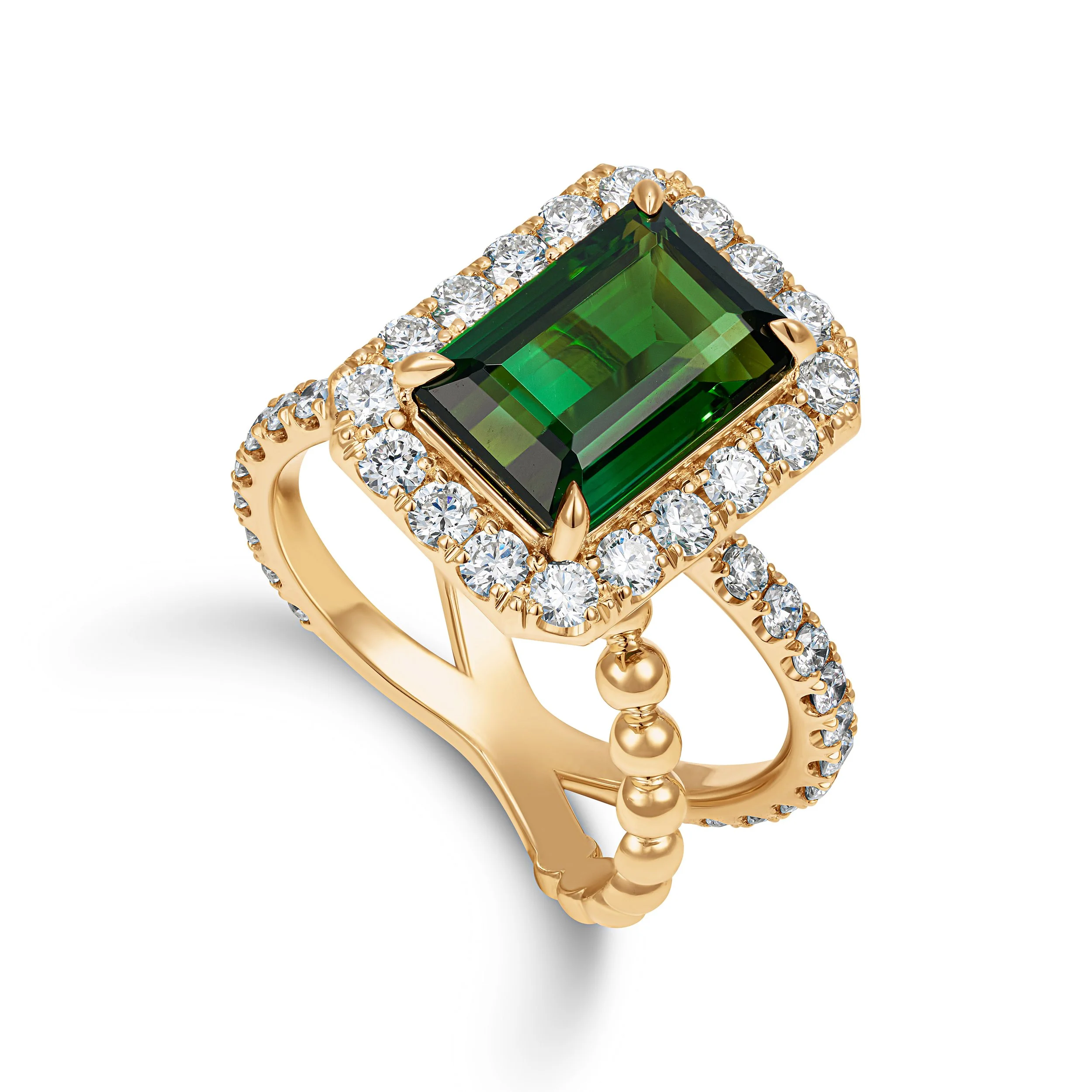 Gold ring with a large emerald-cut green gemstone at the center, surrounded by small diamonds on the band and around the main stone.
