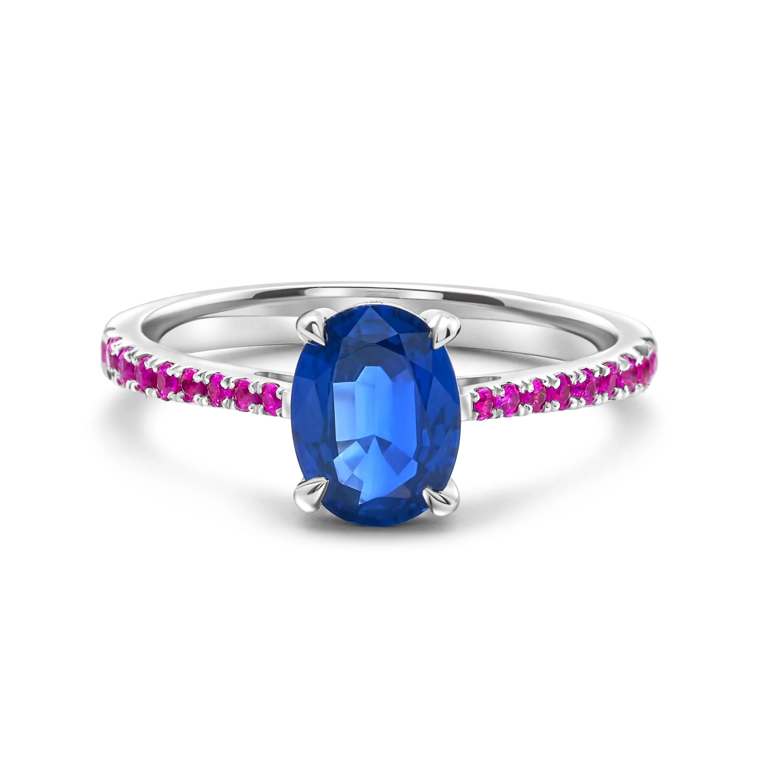 Silver ring with a large blue oval gemstone and small pink stones along the band.