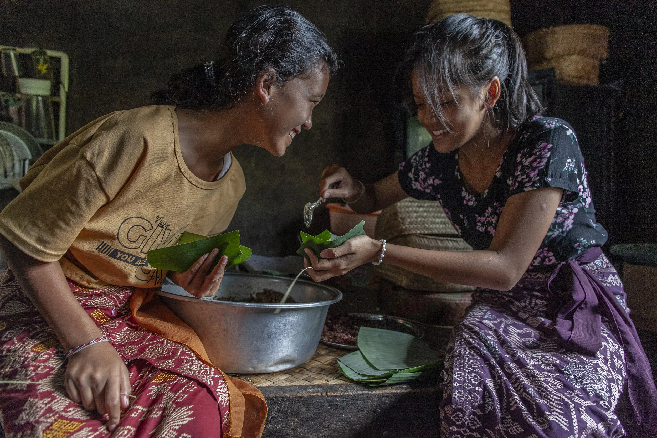 sisters preparing food, Bali, Indonesia