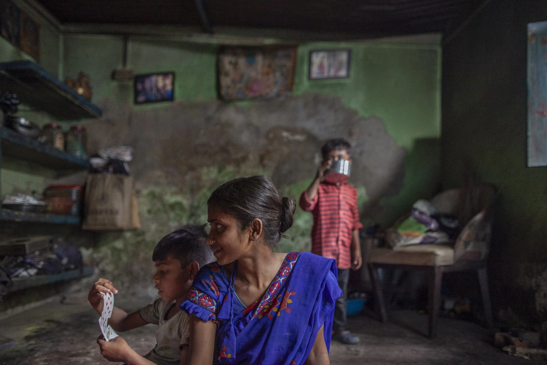 woman with children in simple home
