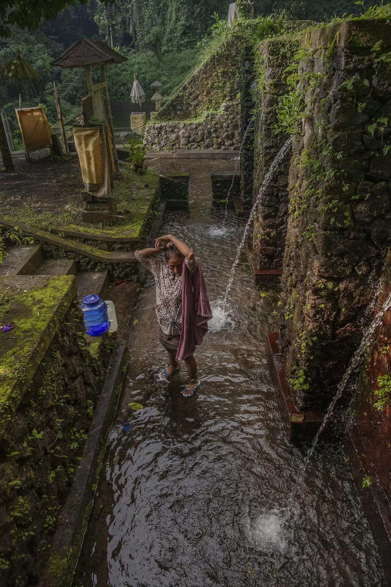woman washing, water temple, Bali, Indonesia