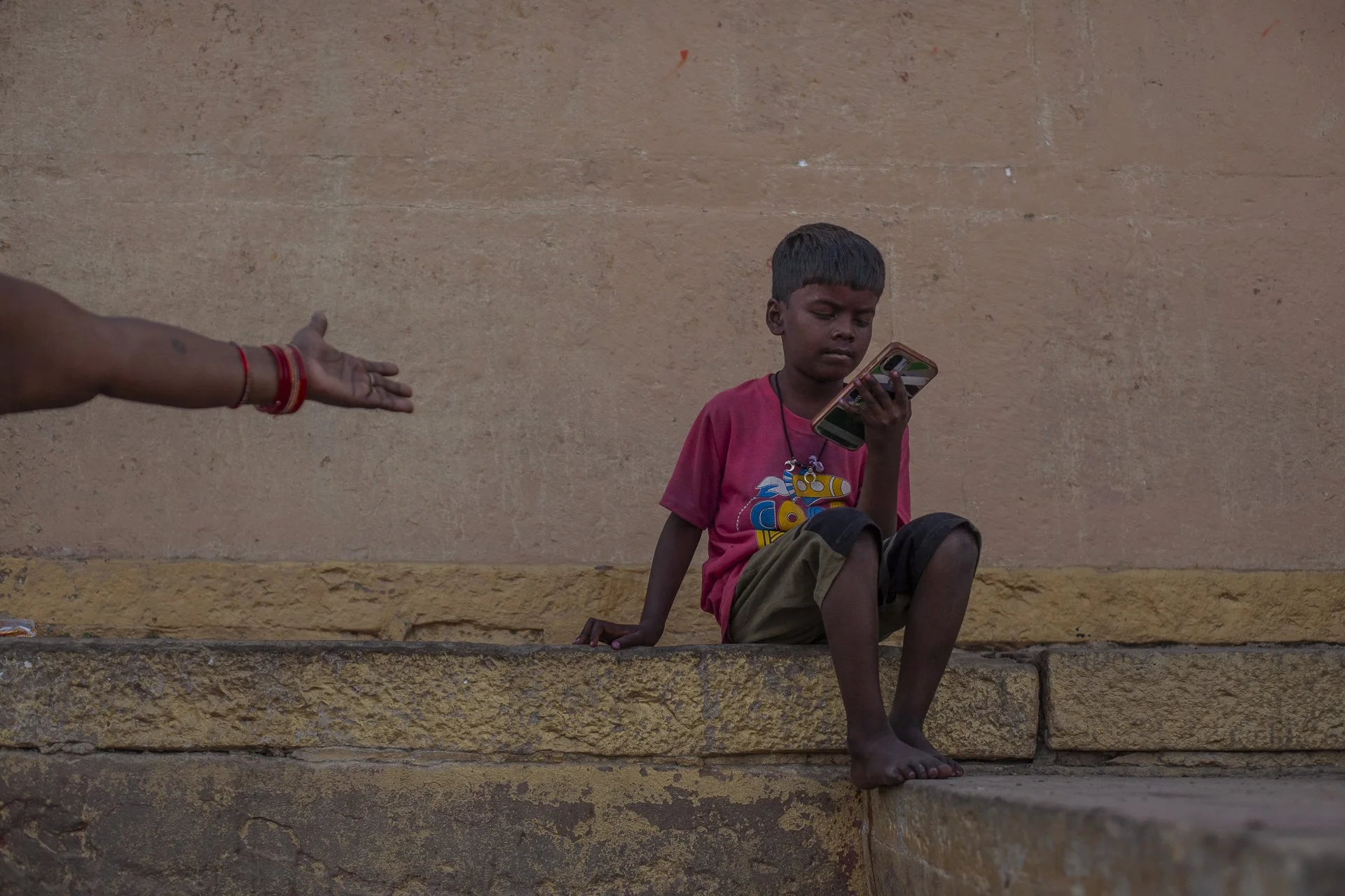 young boy with mobile phone