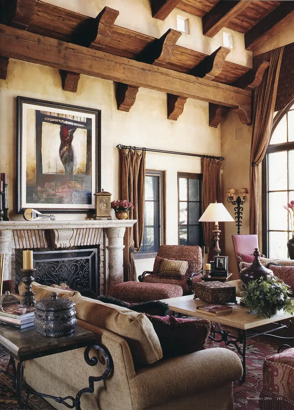  Contemporary artwork adds a splash of color to the traditionally Tuscan sunken living room. A special treatment was used on wood ceiling truss­es to give them an aged look. Fairway views are captured through a large pic­ture window. The painting ove
