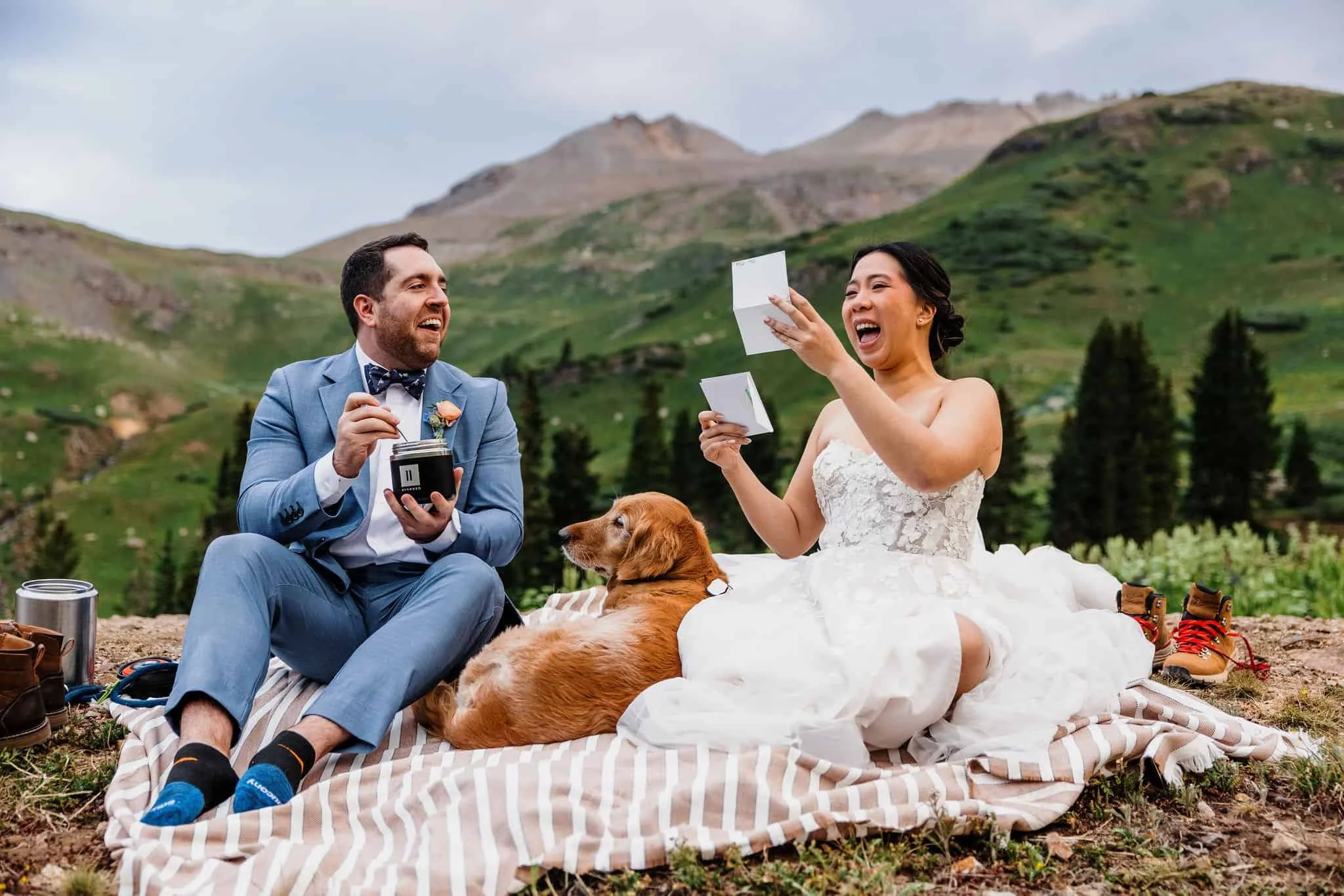 Couple laughs during their elopement picnic
