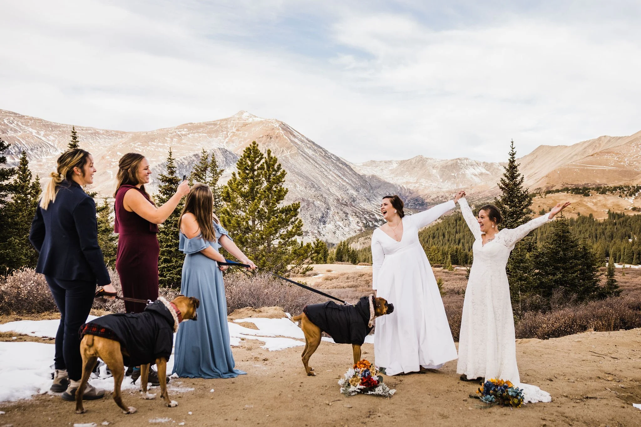 Two brides celebrate at the end of their elopement cermeony