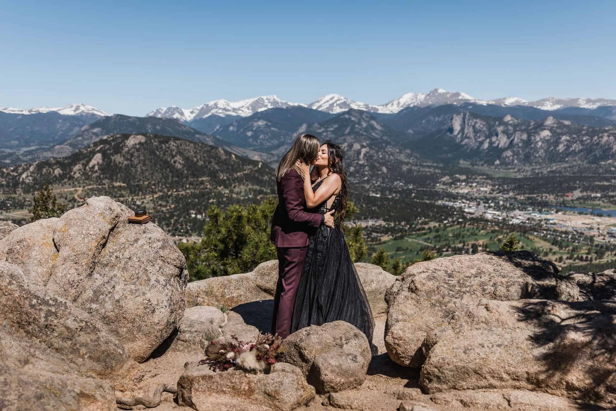 A couple kisses in the mountains