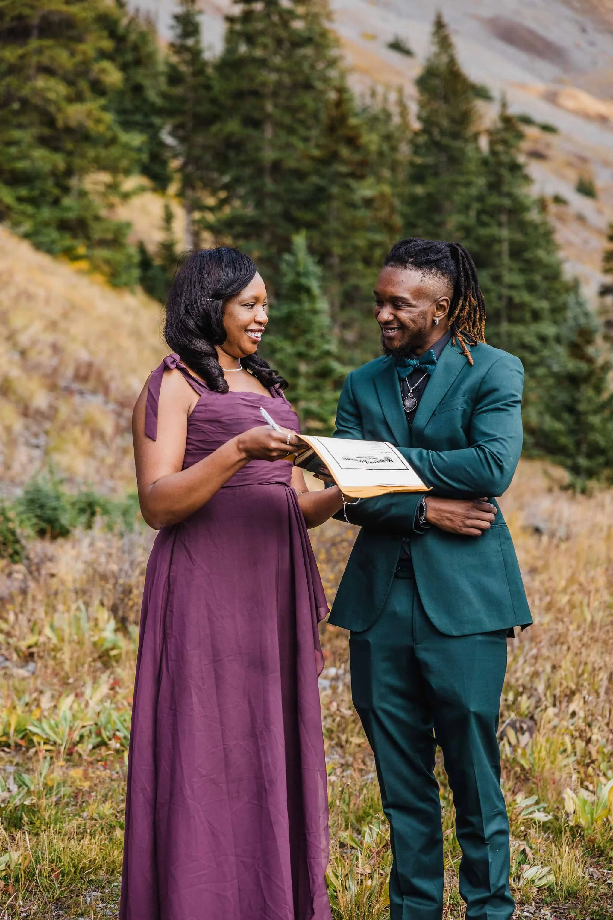 The mother of the groom signs the marriage license