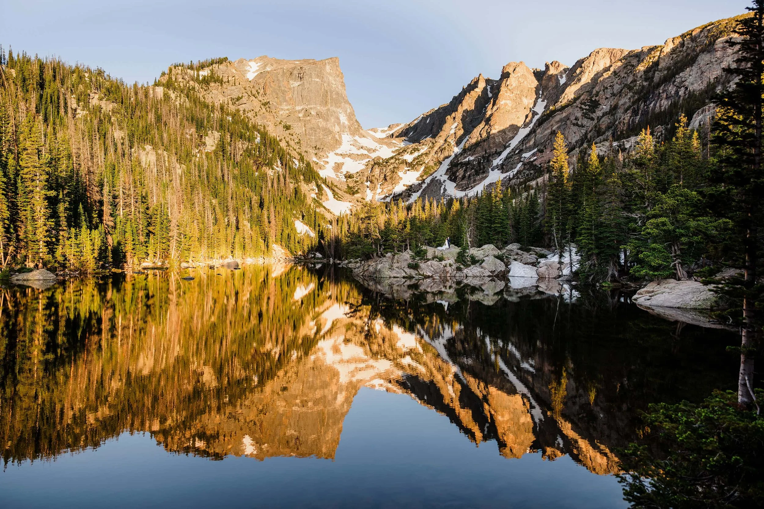 Alpine lake with sharp mountain peaks